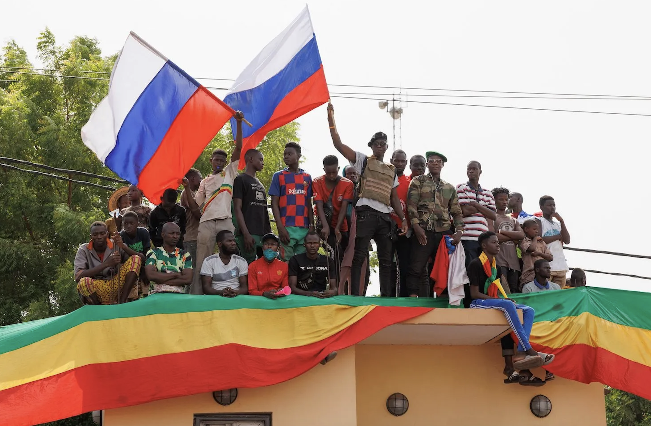 Supporters of Malian Interim President wave Russian flags during a pro-Junta and pro-Russia rally in Bamako.